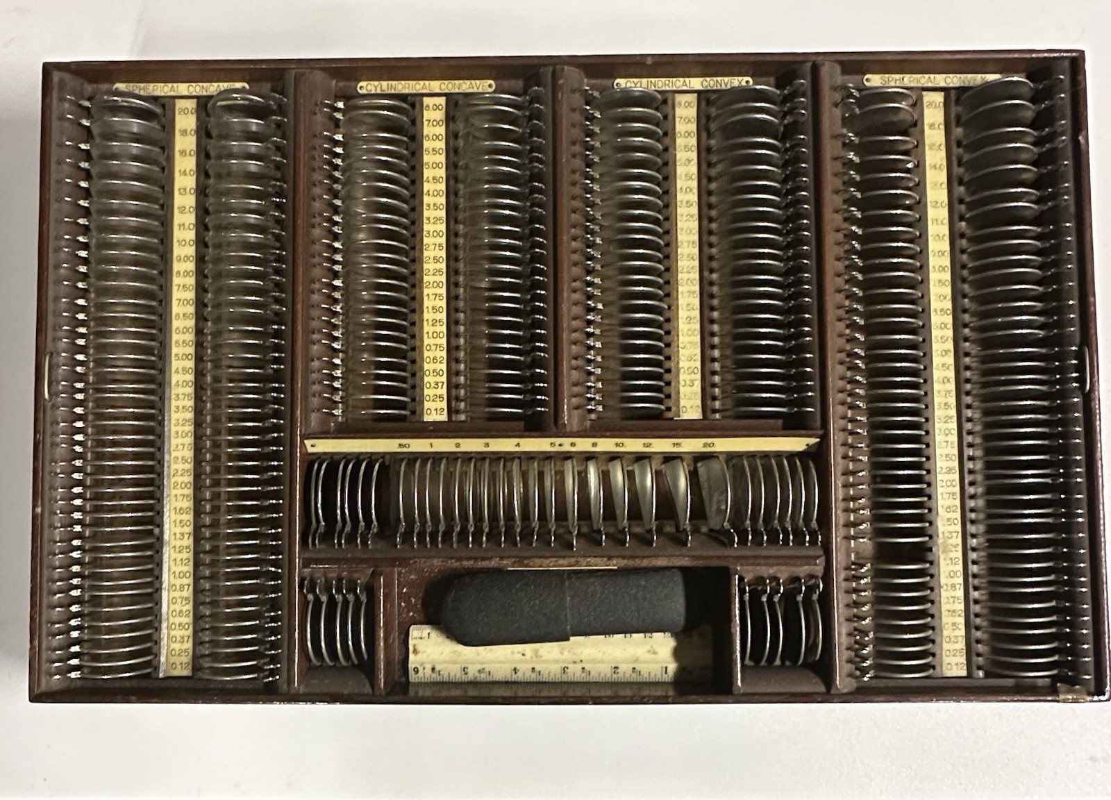 Vintage American Optical optometrist trial lens set housed in a wooden case