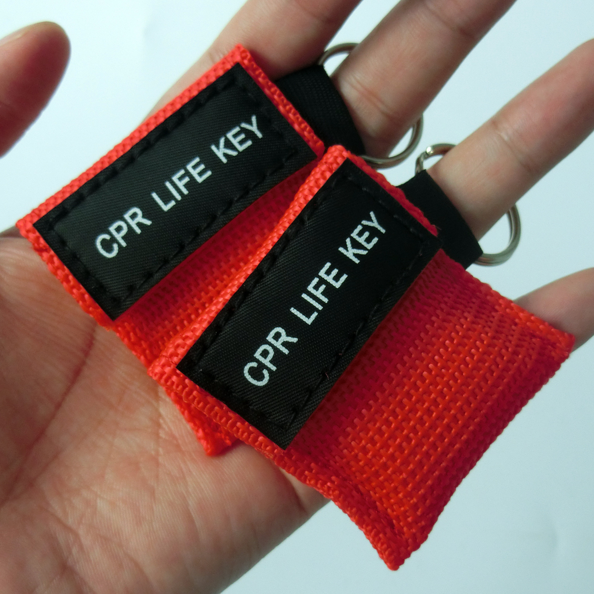 100pcs/pack CPR MASK Disposable Face Shield One Way Valve With KeyChian Pouch