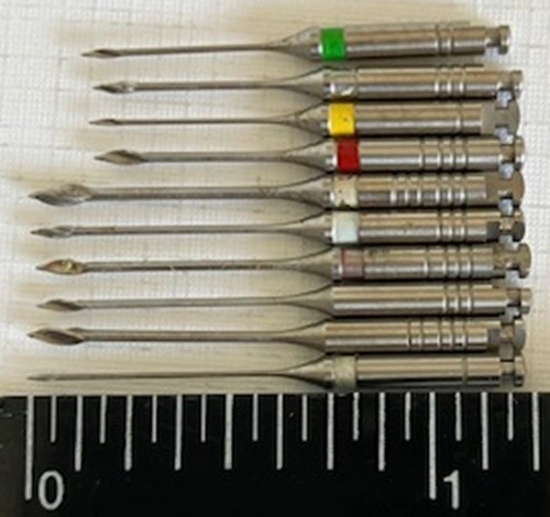 Selection of 10 dental burs, unused