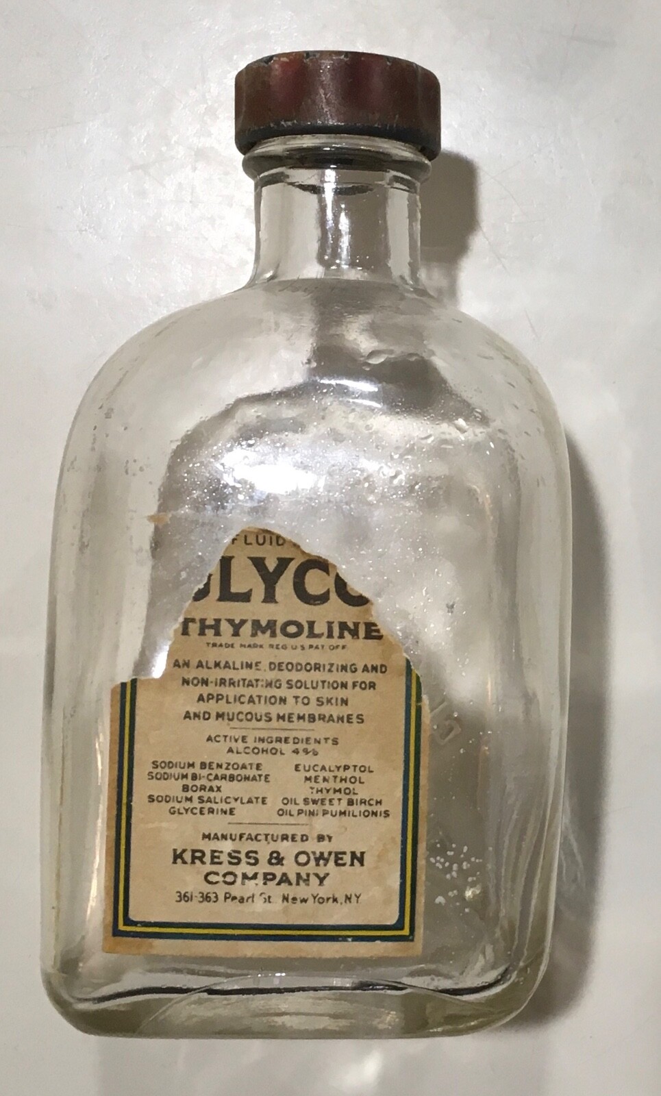 Vintage GLYCO THYMOLINE clear glass bottle w/ cap tattered label 6 fl oz antique