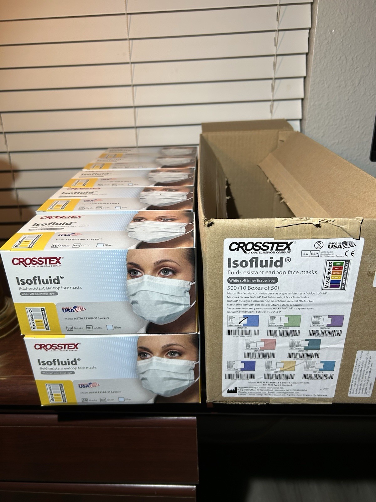 500 Pieces – (10) Boxes Of 50 – Crossed Isofluid Ear loop Face Masks Level 1